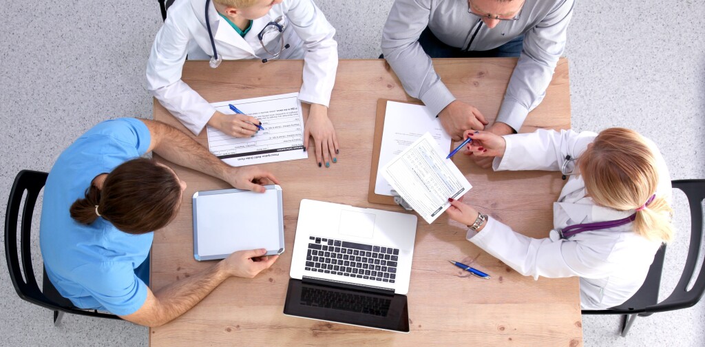 Medical team discussing treatment options with patients.