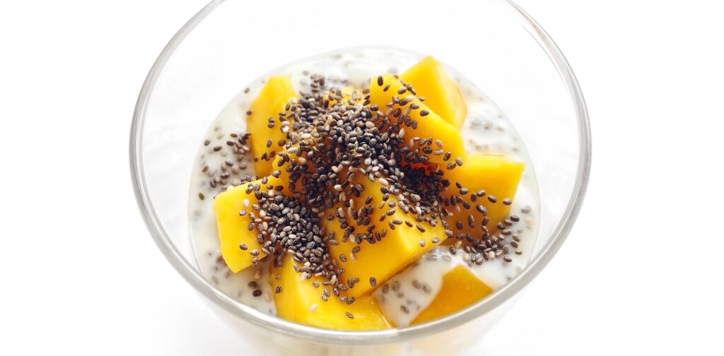 Mango yogurt with chia seeds for healthy breakfast on a white background