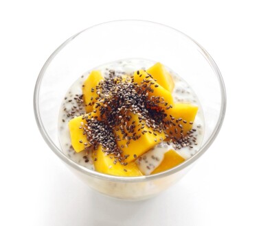 Mango yogurt with chia seeds for healthy breakfast on a white background