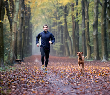 Man running in the Autumn forest