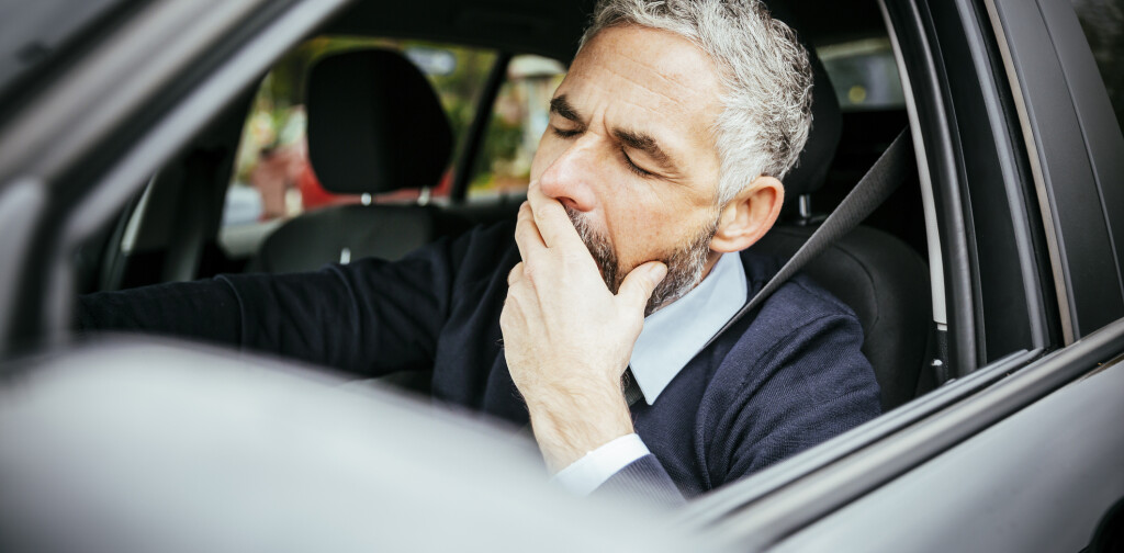 Tired man in car, Vienna, Austria