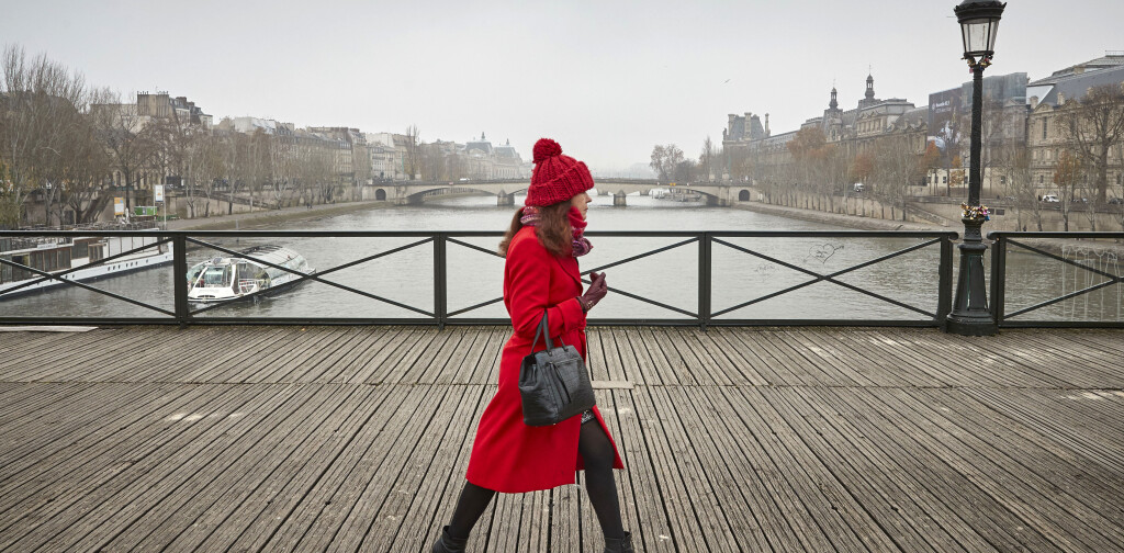 PARIS, FRANCE - DECEMBER 05: A Parisian walks across the Pont des Arts bridge as many have to find alternative transport to get around the city as a nationwide strike grips Paris severely effecting transport across the city in the largest nationwide strike in years on December 05, 2019 in Paris, France. President Emmanuel Macron is facing his biggest test since the Gilet Jaune or “Yellow Vest” movement as railway, transportation workers, Teachers, students, hospital employees, police officers, garbage collectors, truck drivers and airline workers join the strike called in protest to changes to France’s generous pension system. (Photo by Kiran Ridley/Getty Images)